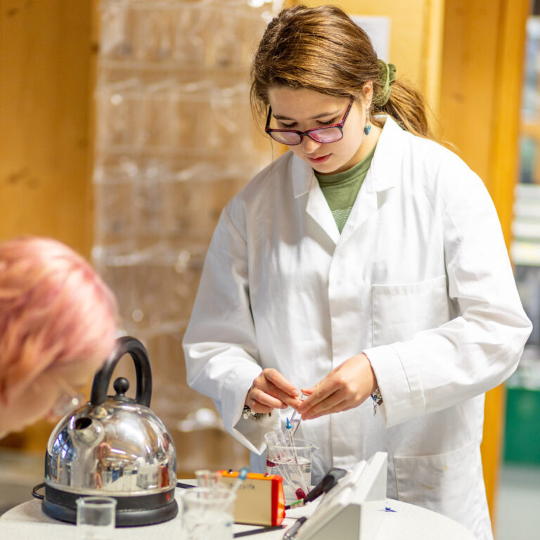 students in science experiment