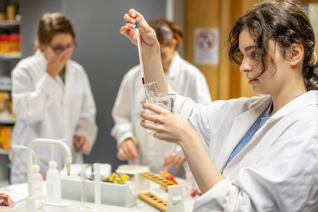 student following science experiment