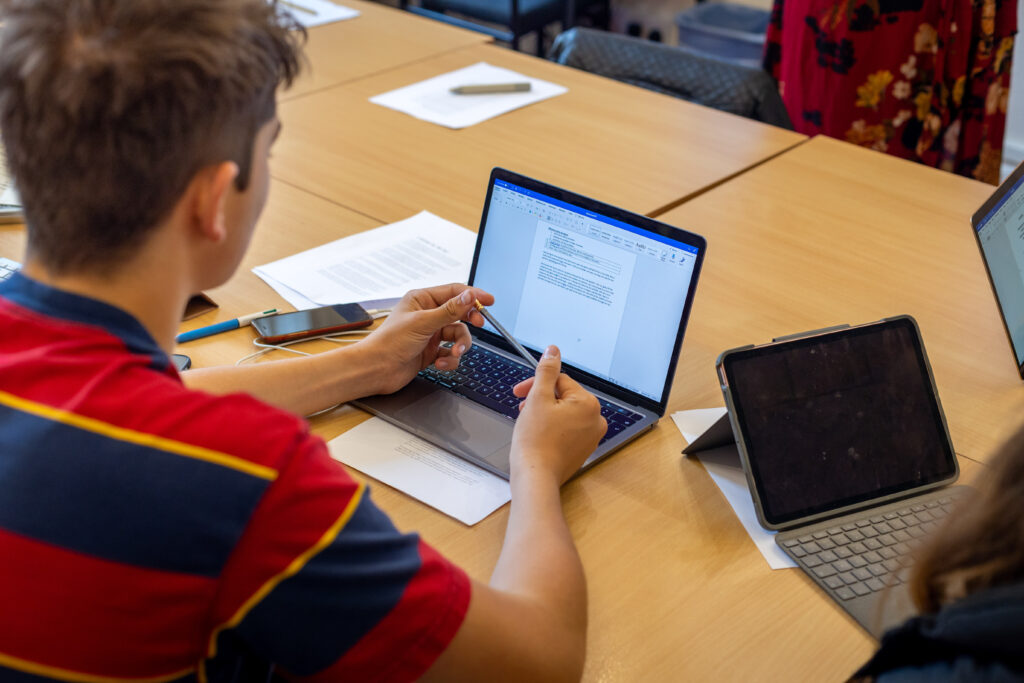 students using laptops and iPads
