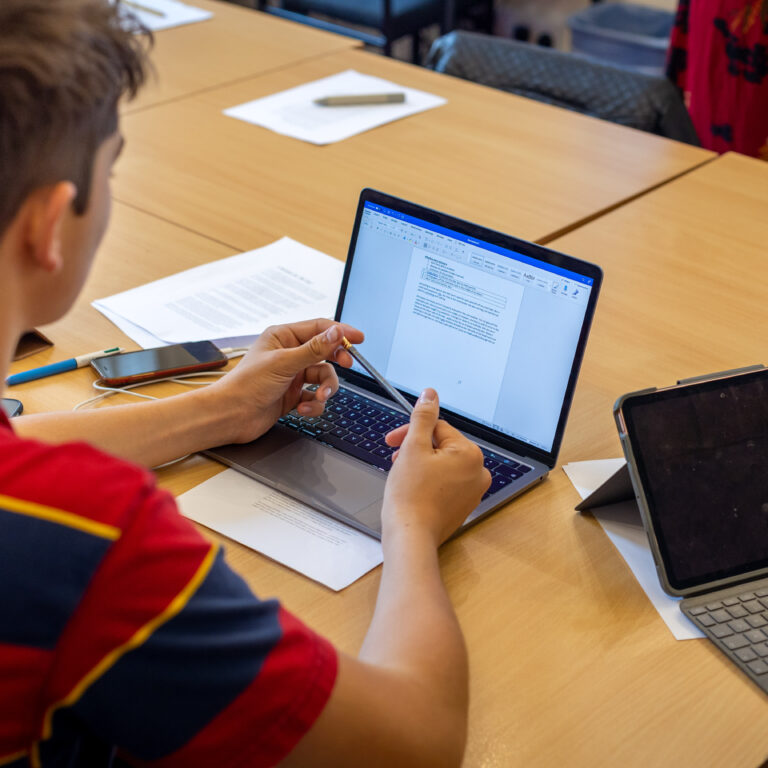 students using laptops and iPads