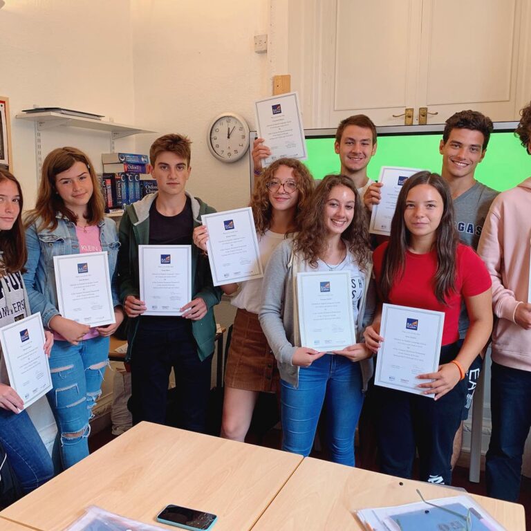 students with certificates in their hands