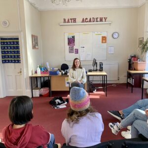 students listening to the teacher in the classroom