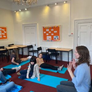 students practicing yoga