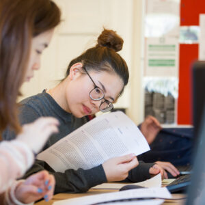 girl reading her work