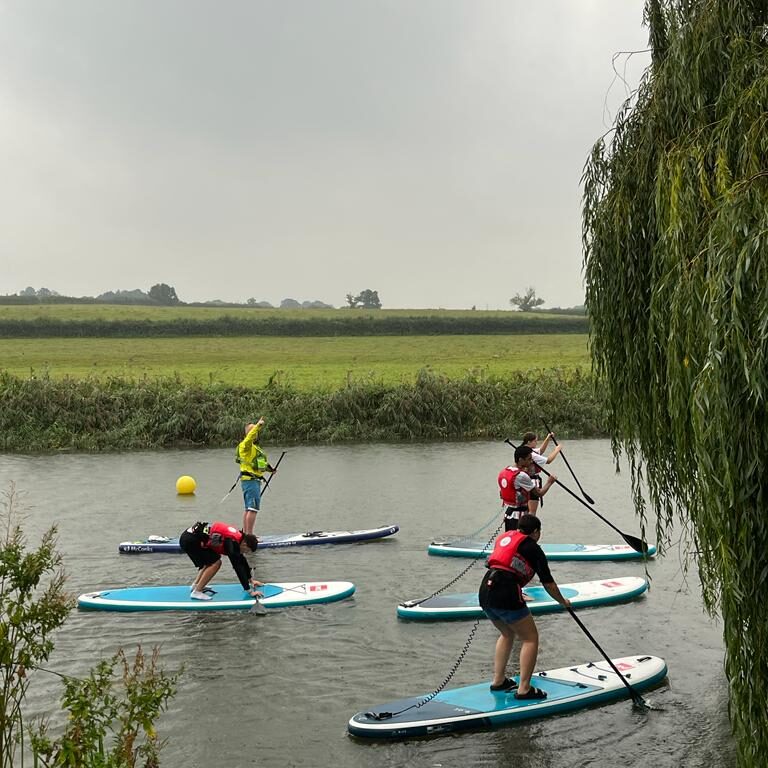 students on surfboards